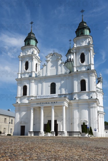 Historic baroque church with twin towers, under a clear sky, Basilica of the Nativity of the Virgin