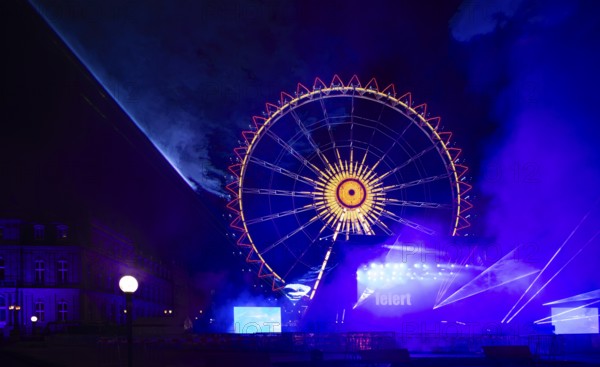 Night shot, rehearsal for New Year's Eve party, theatre, laser show, light show, Ferris wheel,