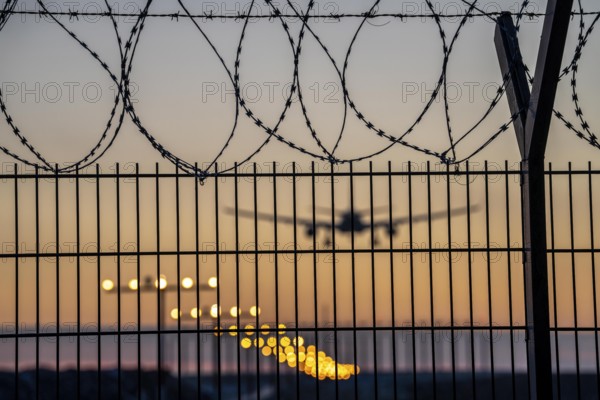 Symbolic image security at the airport, outer fence at Düsseldorf International Airport, steel wire
