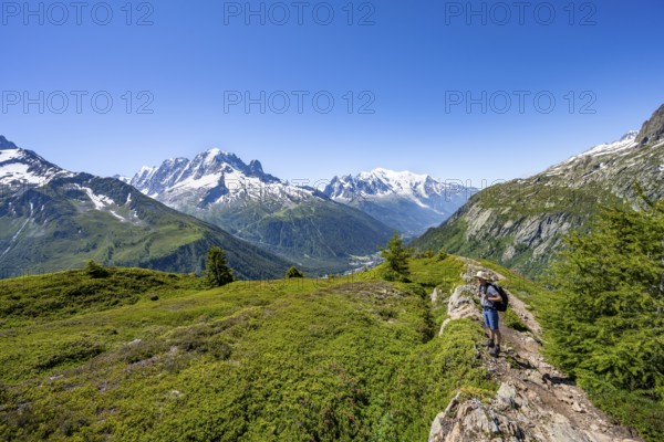 Mountaineer in front of a mountain panorama with glaciated mountain peaks, Aiguille Verte with