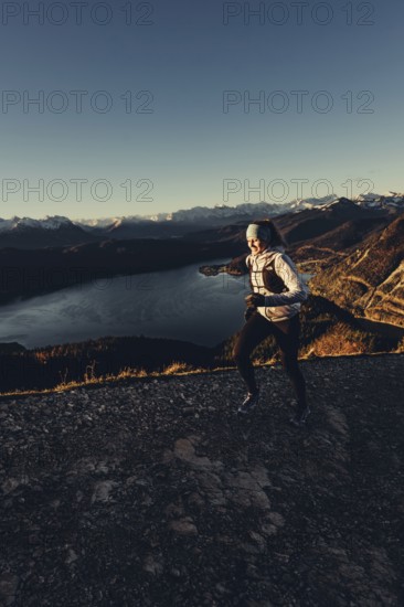Trail running in autumn on the Jochberg on Lake Walchensee against the wonderful backdrop of the