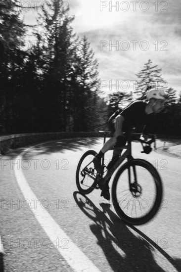 Road bike rider in spring between Lechtal and Tannheimer Tal in front of picturesque scenery of the