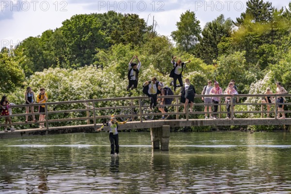 Oxford students jumping into the Thames at Port Meadow in Oxford, Oxfordshire, England, United
