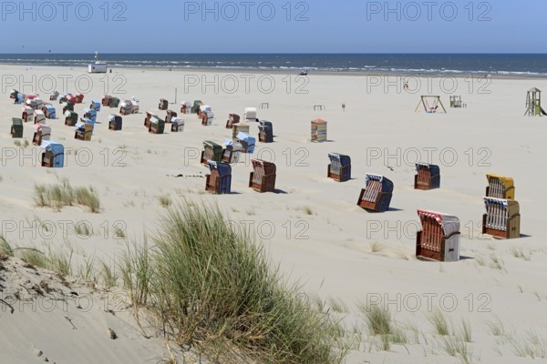 Colourful beach chairs on the beach, blue sky, North Sea, Island of Juist, East Frisian Islands,