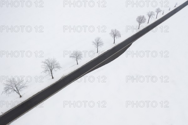 Aerial view of a straight country road in the snow, near Oederan, Saxony, Germany, Europe