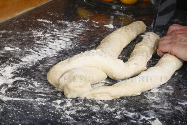Swabian cuisine, preparation of savoury yeast plait with smoked meat, salty wreath bread, yeast
