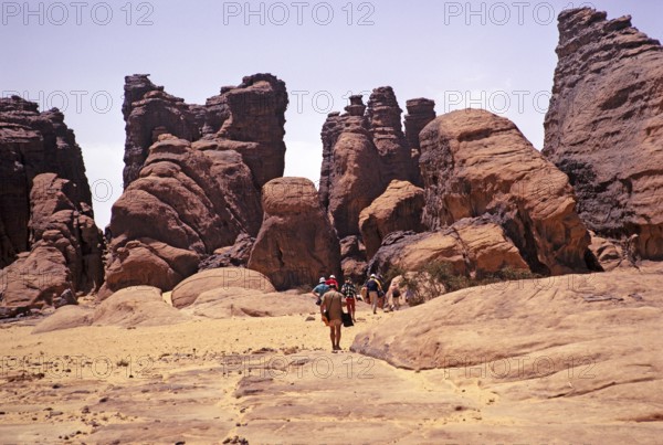 Tourists on their way to cave dwellings, Tassili N'Ajjer National Park, Algeria, North Africa 1973,