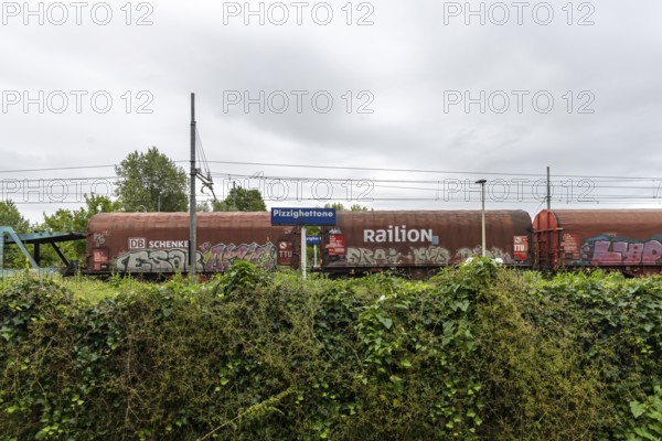 Railway station, Stazione di Pizzighettone with a goods train operated by the logistics company