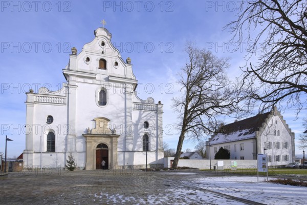 Monastery church of St Peter and Paul and rectory in winter with snow, Oberelchingen, Elchingen,