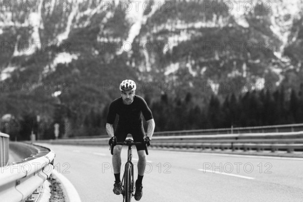Road bike rider in spring between Lechtal and Tannheimer Tal in front of picturesque scenery of the