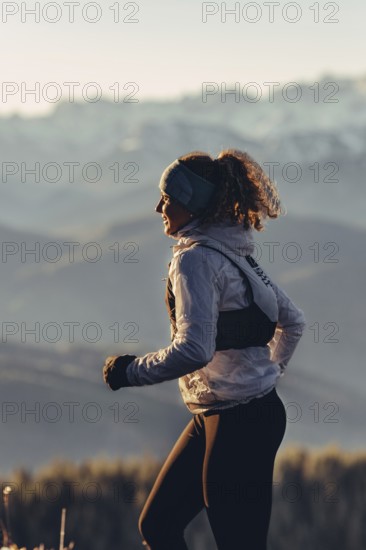 Trail running in autumn on the Jochberg on Lake Walchensee against the wonderful backdrop of the
