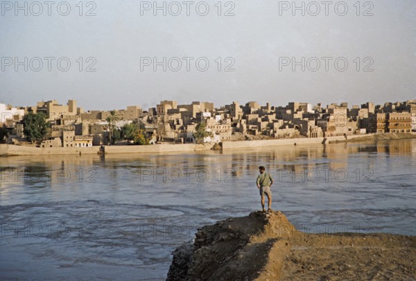 River Indus with a view of the historical buildings of the city of Sukkur, Sindh, Pakistan 1962