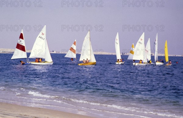 Leisure activities of foreign workers sailing on Wayfarer dinghies, Half Moon Bay, Saudi Arabia