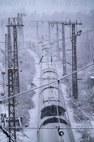 Winter weather, heavy snowfall, railway tracks in front of Essen main station, ICE train, North