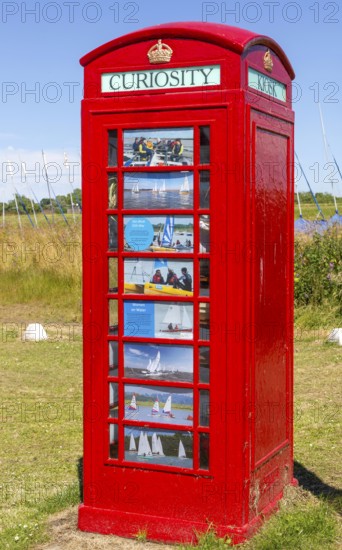 Red K6 telephone box repurposed as local curiosity information booth, Felixstowe Ferry, Suffolk,