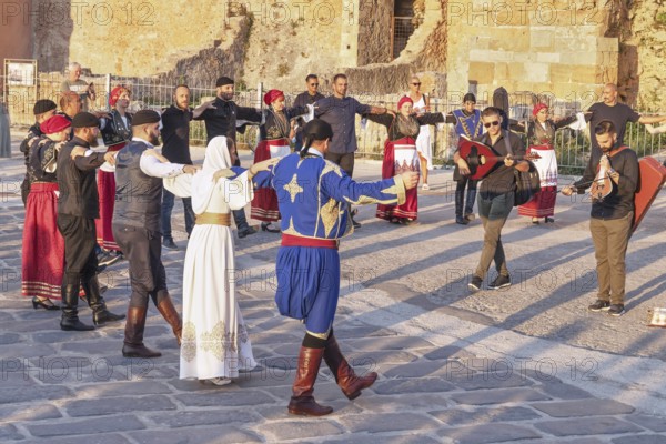 Group of people performing traditional Greek dance, Chania, Crete, Greek Islands, Greece, Europe