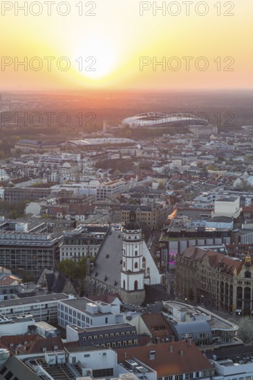 View of the city from the City Tower at sunset, St Thomas' Church, Red Bull Arena and Auwald