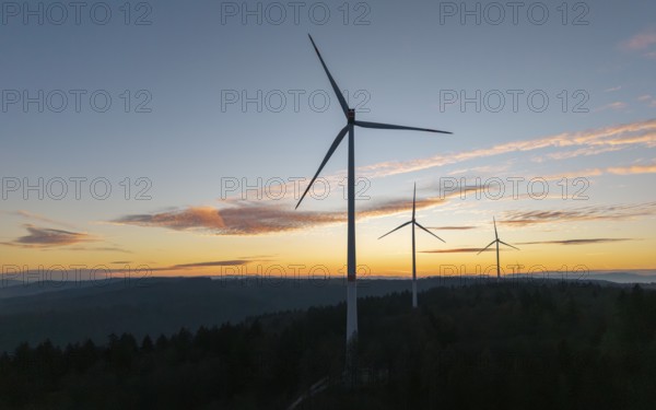 Wind turbines form a silhouette against a dramatic sunrise, wind farm, Rems Valley,