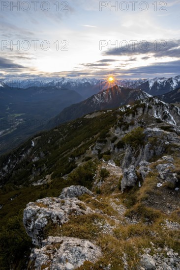 Mountain panorama, mountain landscape with sun star at sunset, at the summit of the Kramerspitz, in