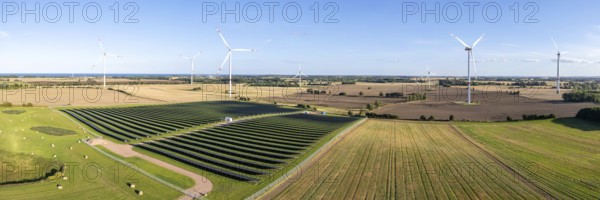 Wind farm and solar cells renewable energy wind power wind energy on the Baltic Sea aerial view