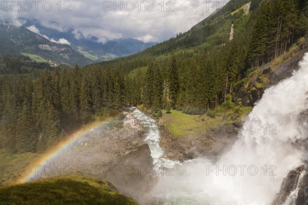 Krimml Waterfalls with rainbow. They have a total height of 380 metres (1, 247 feet) and are the