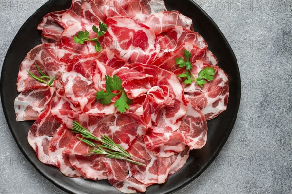 Sliced cured ham, prosciutto, italian dish, delicacy, parma ham, top view, no people