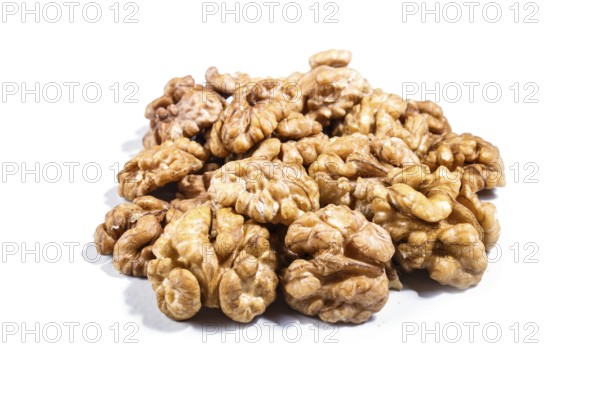 Pile of walnuts isolated on white background. Closeup