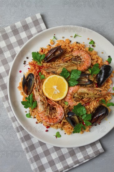 Seafood paella, shrimp and mussels risotto, rice, homemade, top view, no people