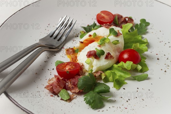 Poached egg, with bacon and vegetables, breakfast, homemade