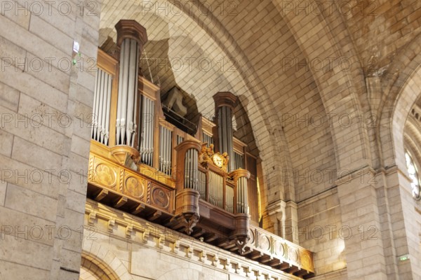 Large wooden church organ in an architecturally impressive interior, Paris