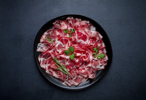 Sliced cured ham, prosciutto, italian dish, delicacy, parma ham, top view, no people