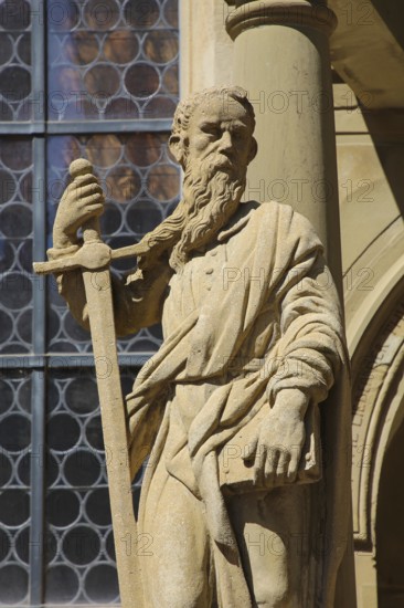 Laurentiuskirche, Protestant church, portal with apostle Paul with sword, stone figure, statue,