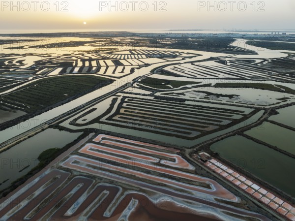 Saline ponds at the salt works near Chiclana de la Frontera. The orange-red colour depends on the