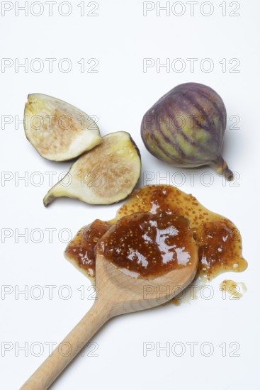 Fig jam in cooking spoon and fresh figs, Ficus carica