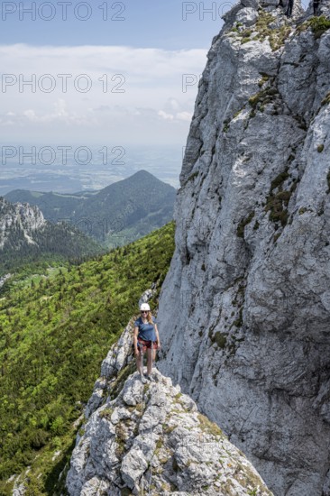 Climber with climbing rope on a climbing tour, climber on a mountain ridge, alpine climbing,