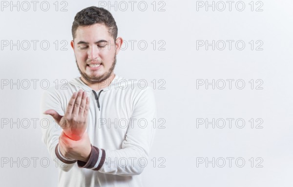 Person with arthritis pain rubbing hand isolated. Suffering young man with pain in hand joints