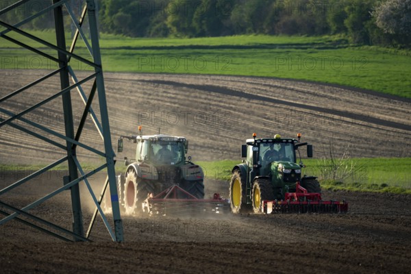 Tractor working a field near Grevenbroich, in spring, Germany, Europe