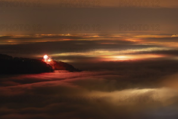 New Year's Eve fireworks 2024 on the Breitenstein, Swabian Alb near Ochsenwang. Sea of fog in the