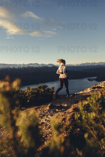 Trail running in autumn on the Jochberg on Lake Walchensee against the wonderful backdrop of the