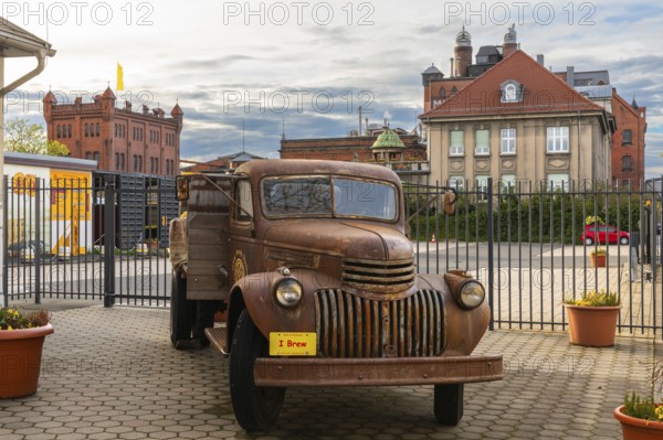 Historic car in front of the Weyermann malthouse, Bamberg, Lower Franconia, Bavaria, Germany,