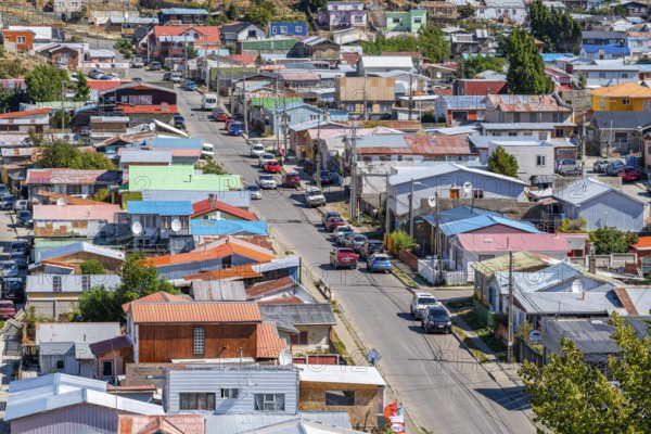 View over a street and colourful houses made of wood and corrugated iron, city of Punta Arenas,