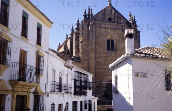 Cathedral church set among historic whitewashed houses in the old town of Ronda, Andalucia, Spain,
