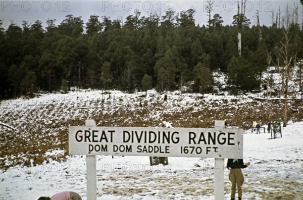 Sign for Dom Dom Saddle of the Great Dividing Range, Victoria, Australia 1956 Children playing in