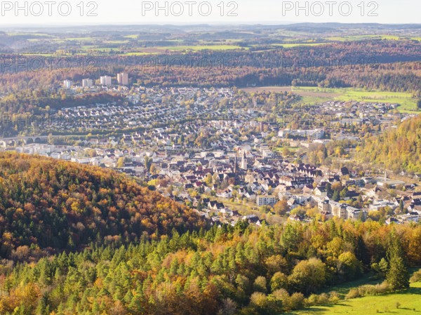 View of a town on the edge of an autumn-coloured forest, visible from the air, high ropes course,
