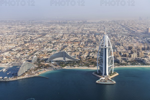 Dubai Burj Al Arab luxury hotel aerial view aerial view by the sea from above in Dubai, United Arab