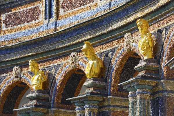 Gilded bust, facade, exterior walls, decorated, colourful, coloured stones, crystals and glass