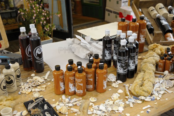 Market stall with typical liqueurs, shopping street, Den Burg, Texel Island, North Sea, North