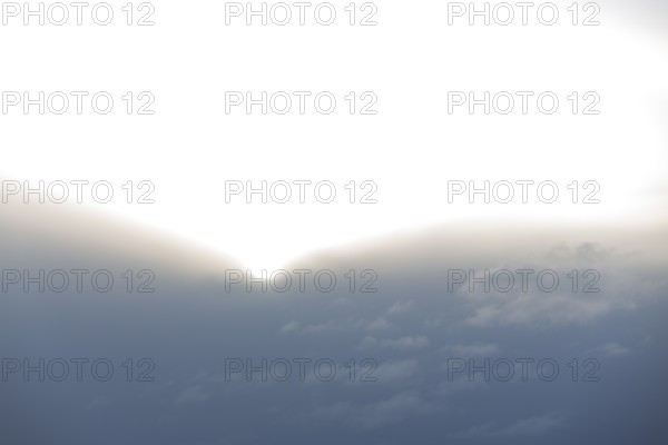 Sun comes out of thick cloud wall, Germany, Europe