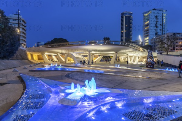 Modern architecture and colourfully lit fountains of Eleftheria Square at dusk, Nicosia, Cyprus,