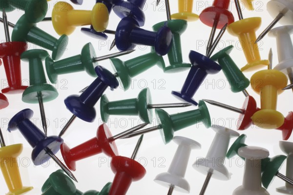 Lots of colourful pins, pushpins, drawing pins